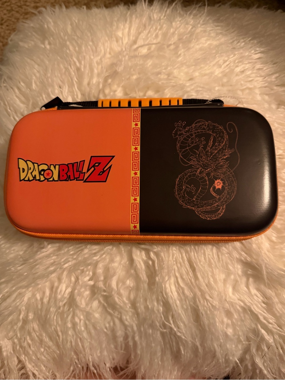 Nintendo Switch Dragon Ball Z Hard
Shell Travel Case, Orange/Black
